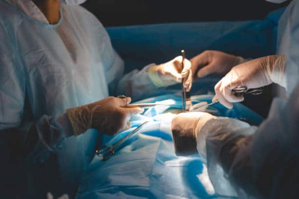 Surgeons doing a Spinal Laminectomy Surgery to the patient 