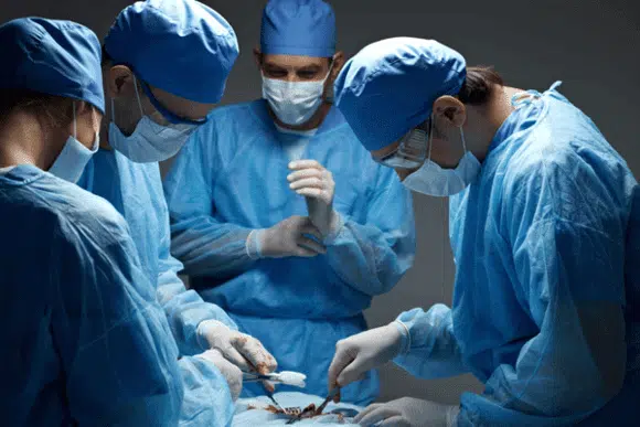 surgeons doing Nerve decompression Surgery inside the operating room. 