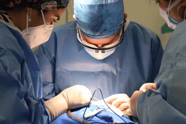 Surgeons performing Nerve decompression Surgery inside the operating room. 