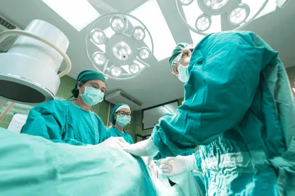 surgeons performing Peripheral Nerve Surgery inside the operating room.