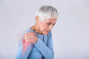 Senior woman with shoulder pain. 