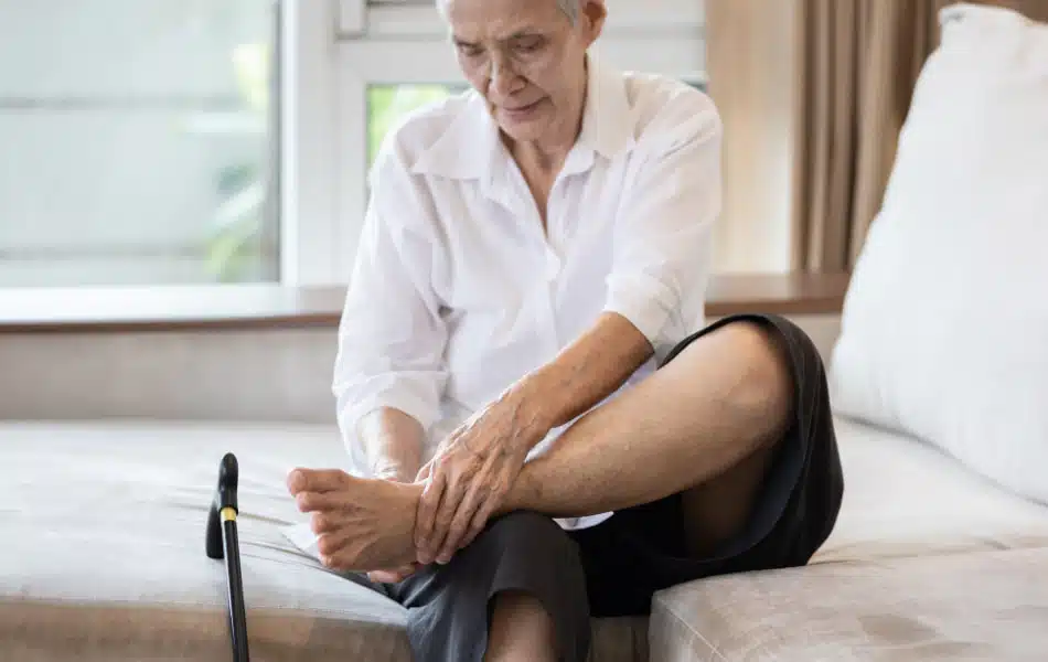 Senior woman suffers from peripheral neuropathy .