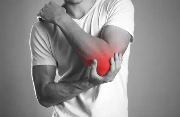 Man suffers from tennis Elbow pain.