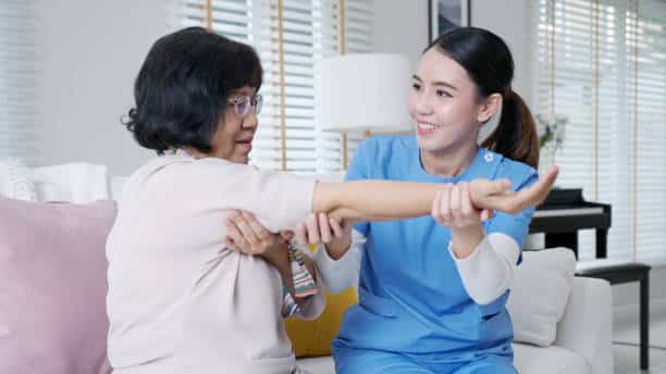 Senior patient having her elbow evaluation at the surgery center.