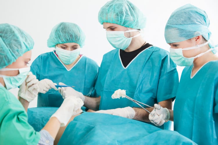 Spine surgeons doing a surgery inside the operating room