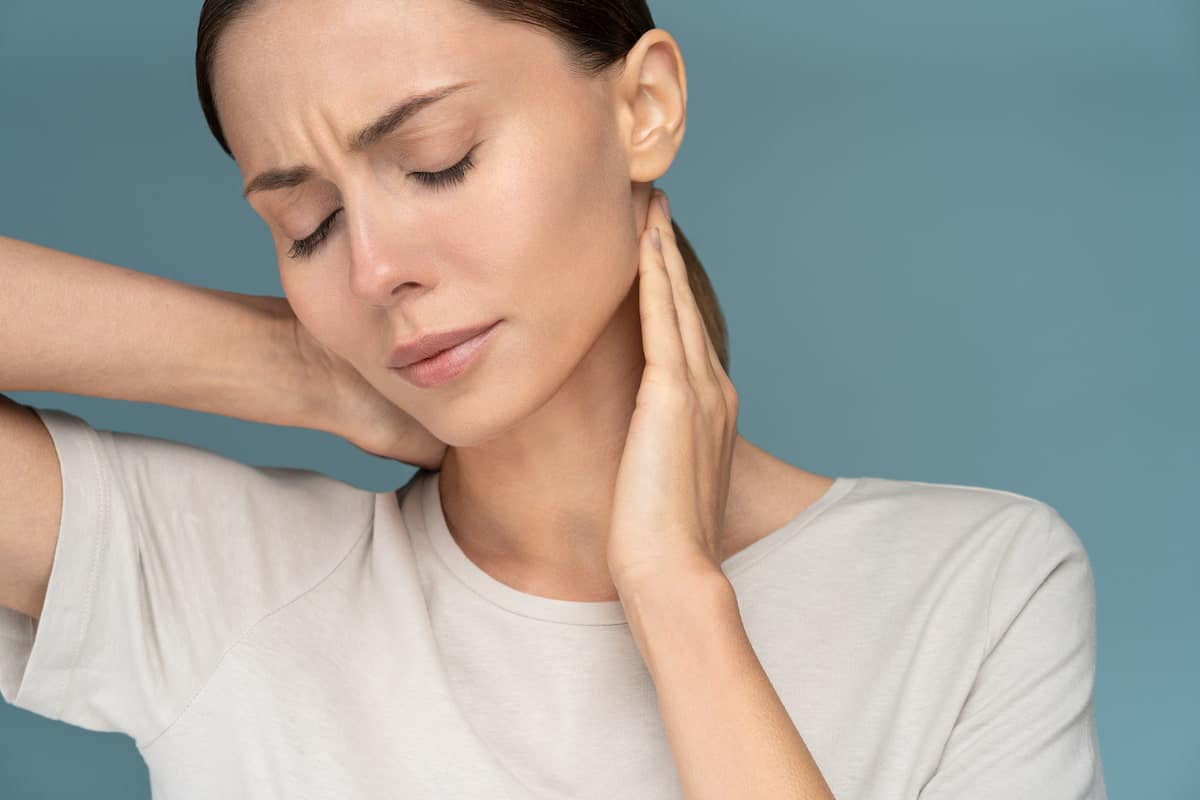 Woman suffering from chronic neck pain.