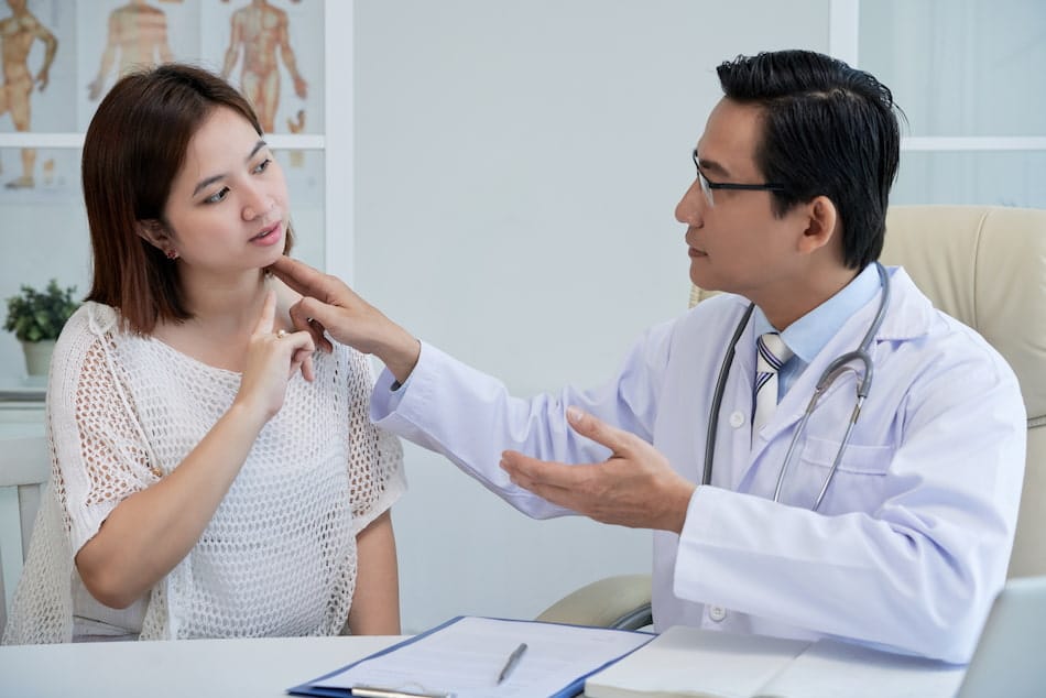 Woman who suffers from chronic pain having an evaluation with a pain management doctor