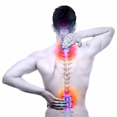 Man holding his back gesturing where the pain is in his spine